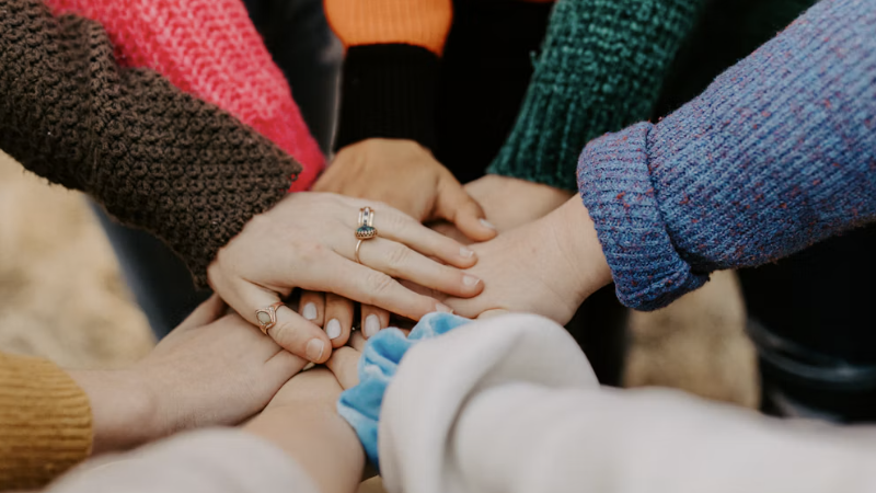 friends hands piled togethger